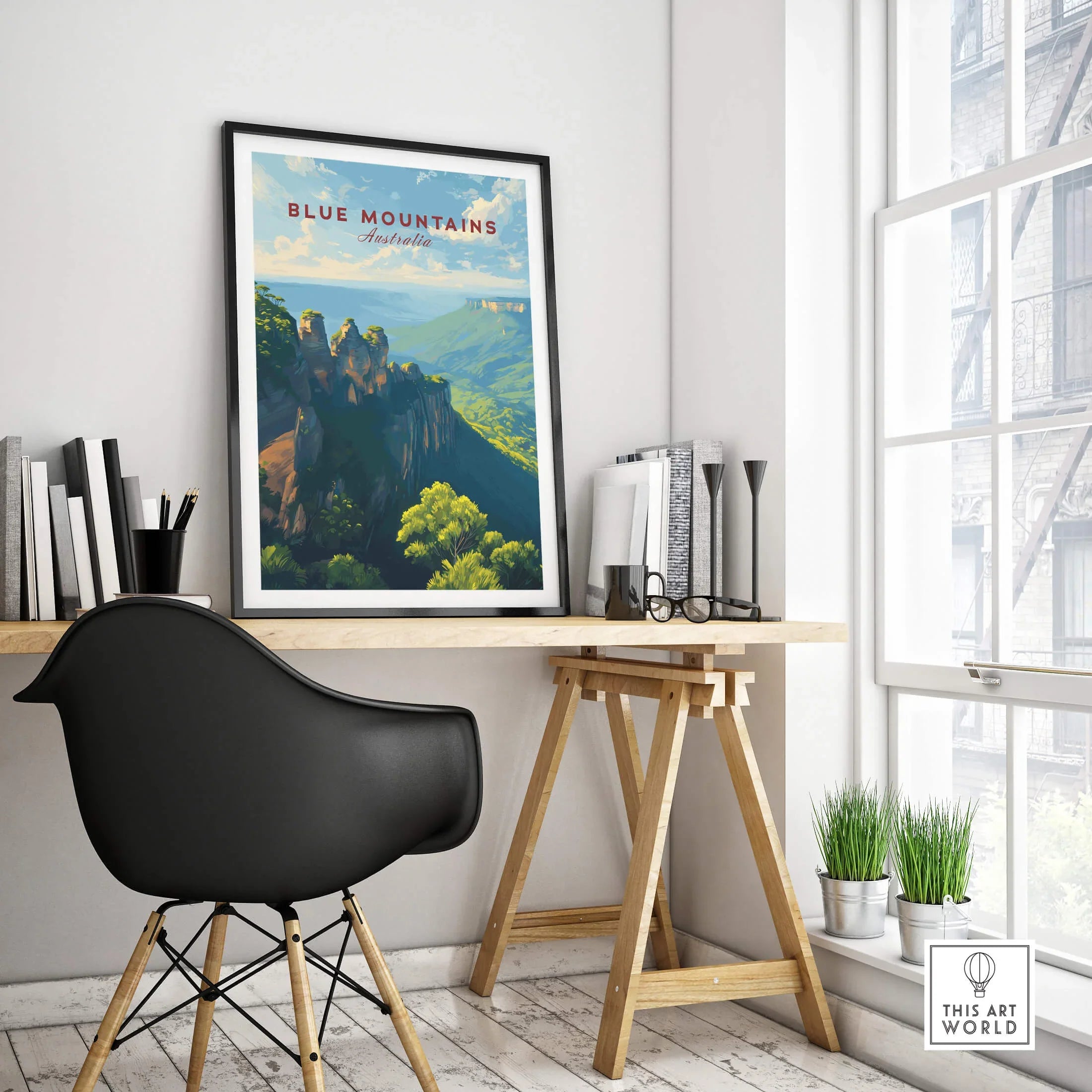 Framed Blue Mountains Australia travel poster on modern office desk with natural light