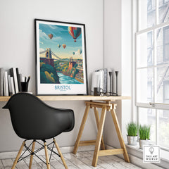 Bristol Canvas Print - Wall Art Poster displayed in a modern workspace featuring vibrant cityscape and hot air balloons.