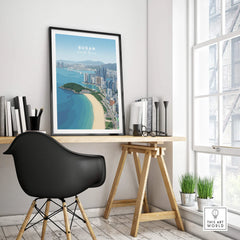 Framed Busan South Korea skyline travel poster on modern office desk decor