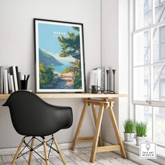 Busan travel poster with coastal scenery in black frame on modern office desk