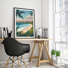 Byron Bay Australia Travel Poster featuring a scenic coastal view and vibrant tropical colors in a modern workspace.