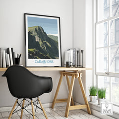 Framed Cadair Idris Wales travel poster on modern office desk by window