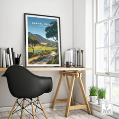 Carmel Valley California travel poster in black frame on modern office desk by window