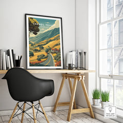 Carmel Valley California travel poster in black frame on modern office desk, minimalist decor