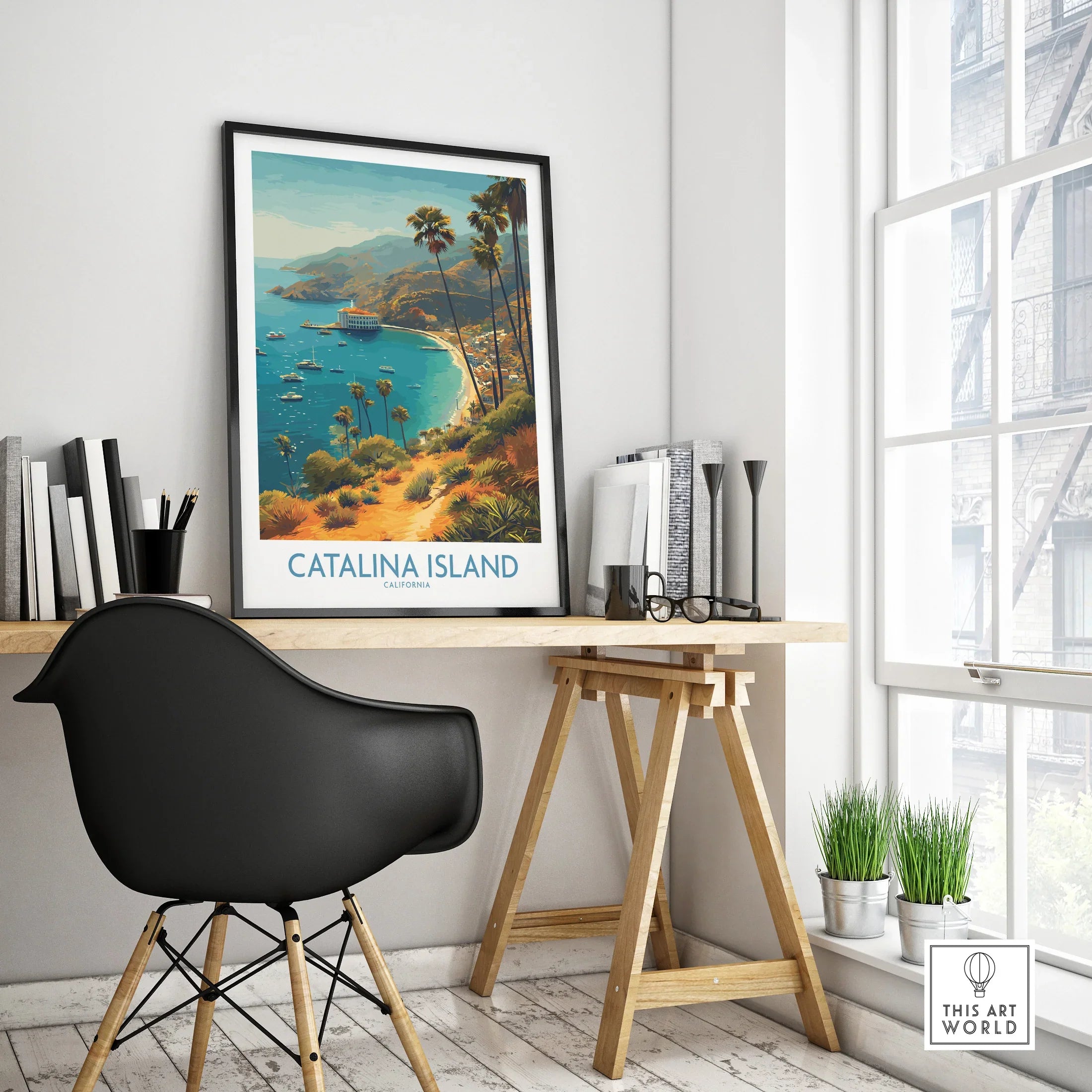 Catalina Island travel poster with palm trees in black frame on modern office desk