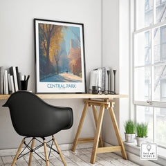 Central Park framed travel poster on modern office desk with black chair and autumn trees artwork