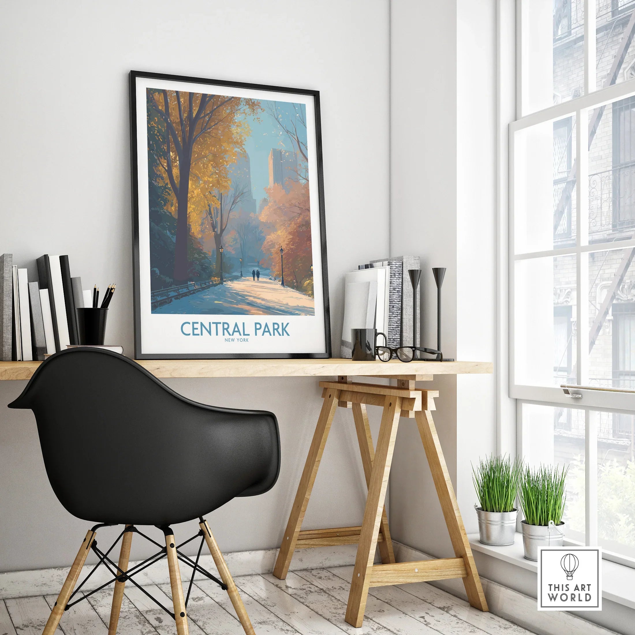 Central Park framed travel poster on modern office desk with black chair and autumn trees artwork