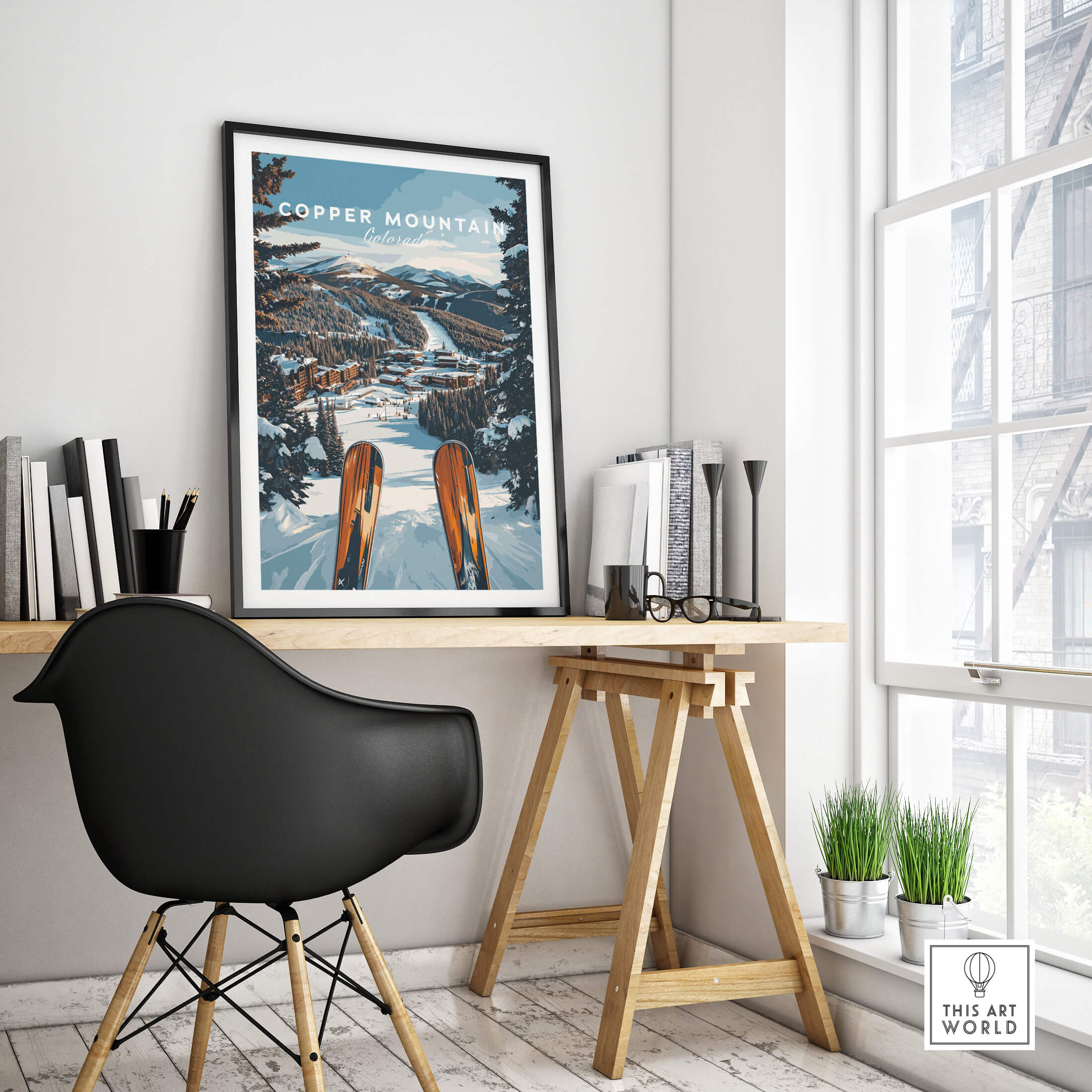 Stylish interior featuring a Copper Mountain Ski Print above a wooden desk and a black chair.