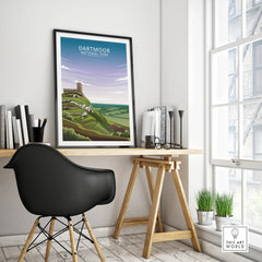 Framed Dartmoor National Park travel poster on modern office desk with black chair