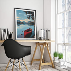 Derwentwater Travel Poster – Lake District Art Print displayed in a modern workspace with a black chair and natural light.