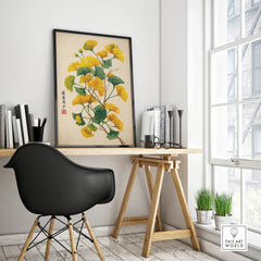 Modern office desk with framed botanical wall art print and black chair