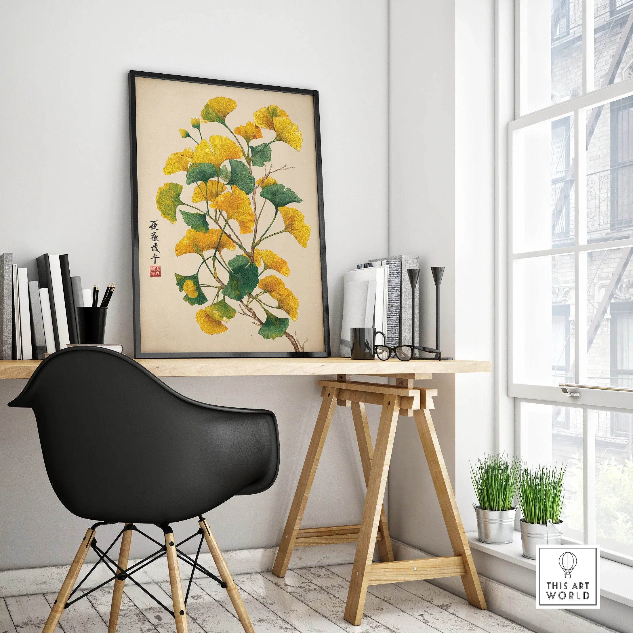 Modern office desk with framed botanical wall art print and black chair