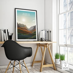 Glencoe National Park travel poster in black frame on modern desk in bright office setting.