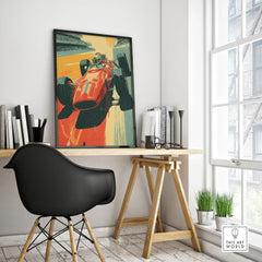 Framed vintage race car poster on a modern office desk with black chair and books