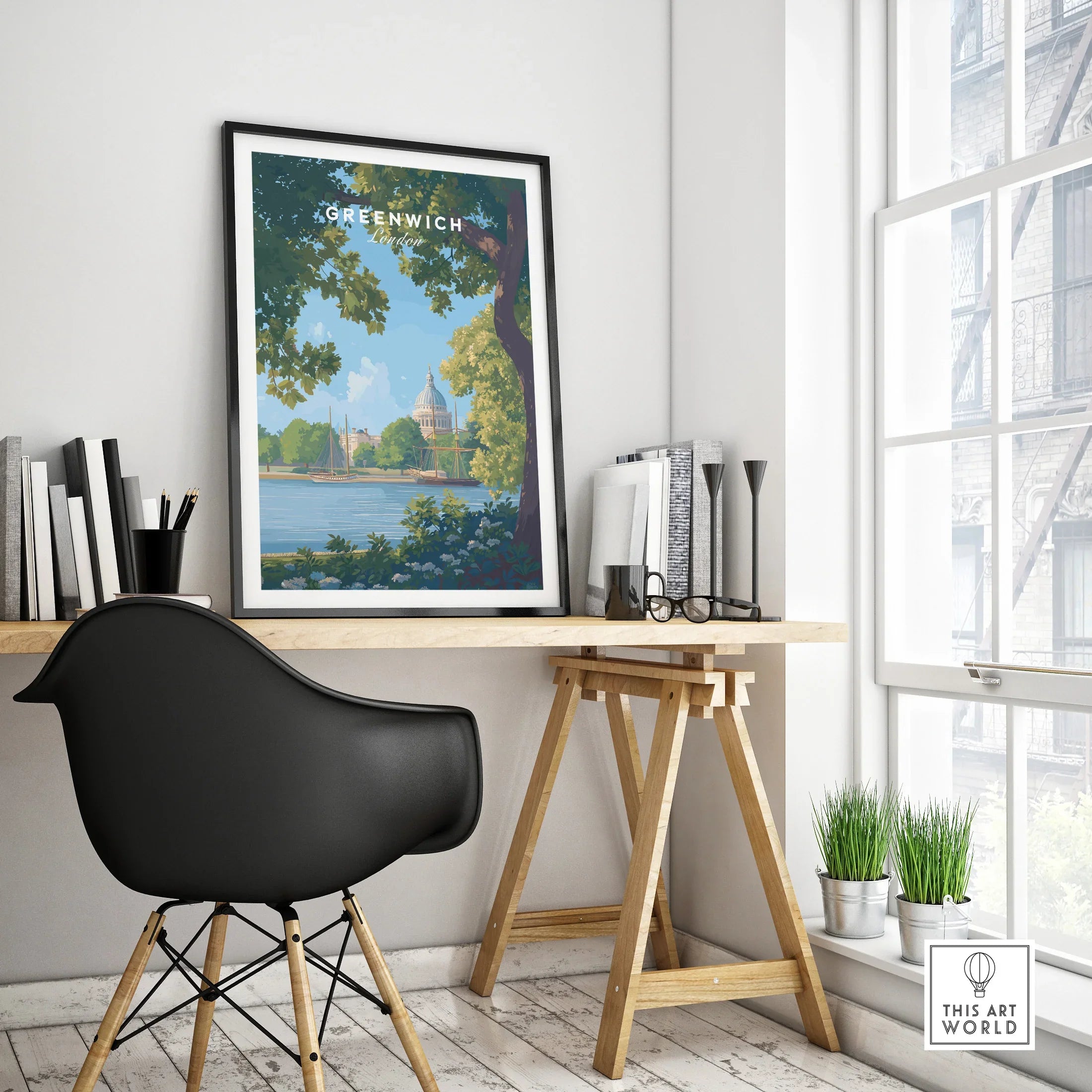 Framed Greenwich London travel poster on modern office desk with black chair, natural light
