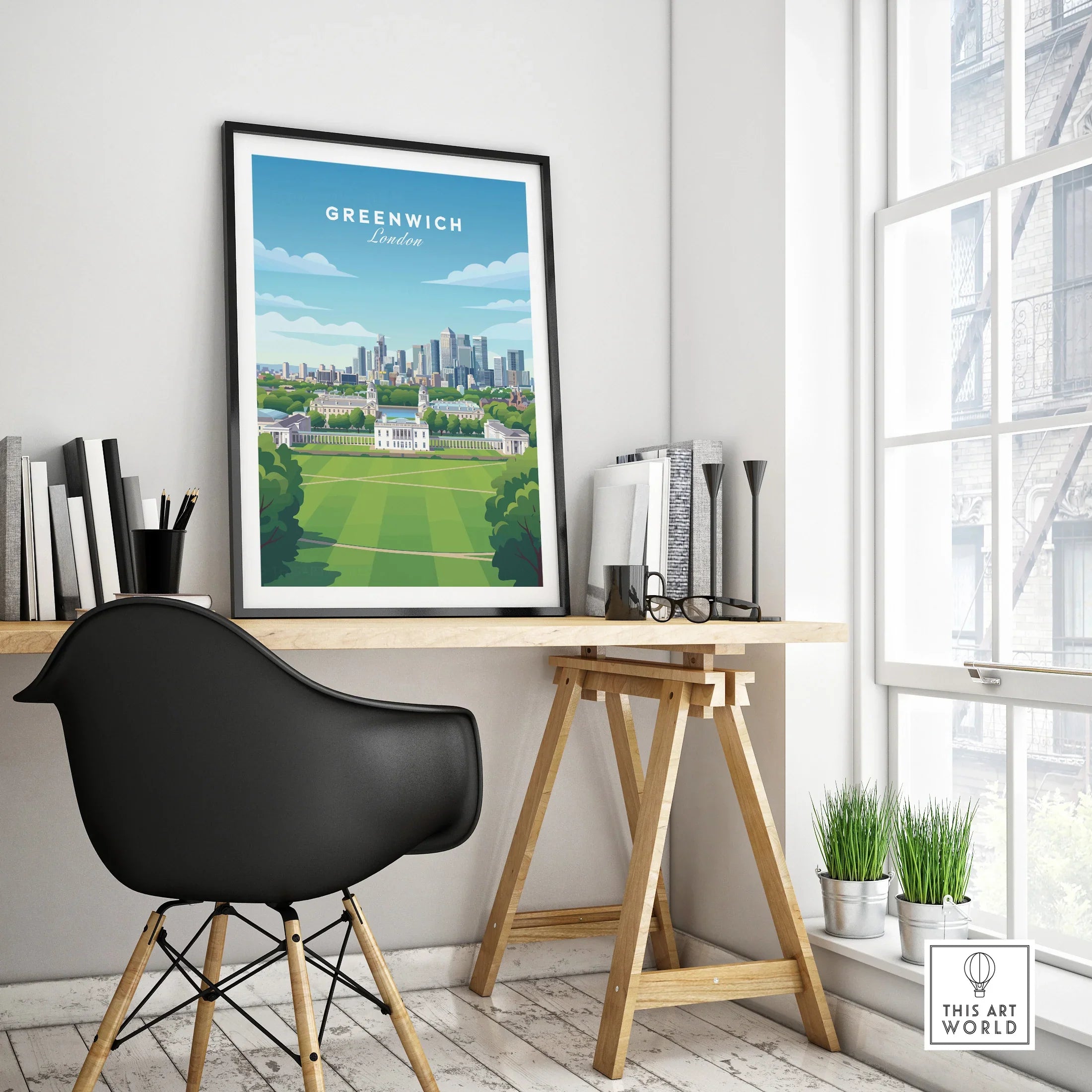 Greenwich London travel poster in black frame on modern office desk with city skyline art