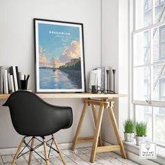 Framed Greenwich London travel poster on modern office desk with chair and decor