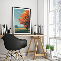 Greenwich London travel poster framed on modern office desk with black chair and autumn tree art