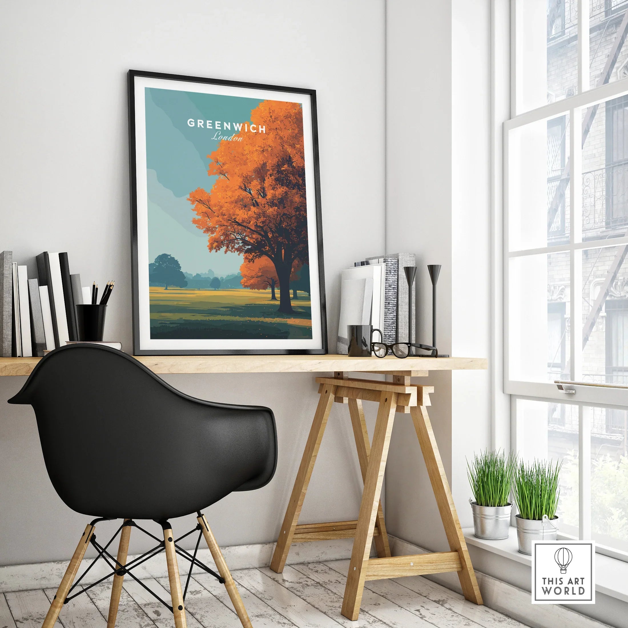 Greenwich London travel poster framed on modern office desk with black chair and autumn tree art
