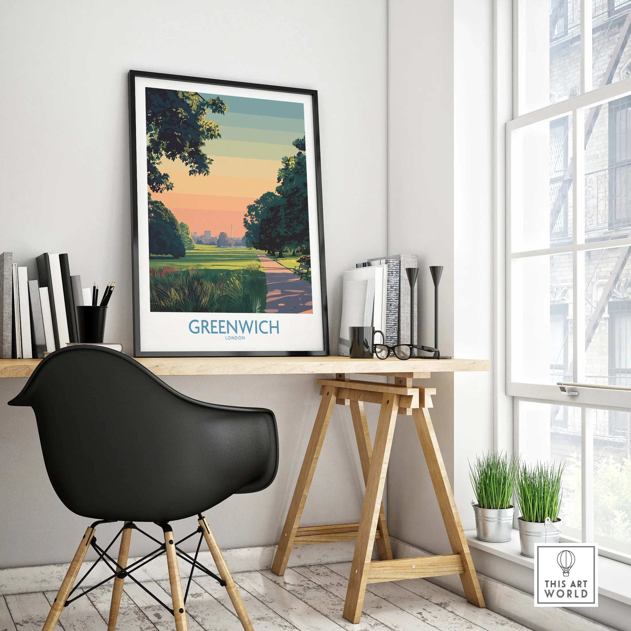 Framed Greenwich London travel poster on modern office desk with black chair and decor