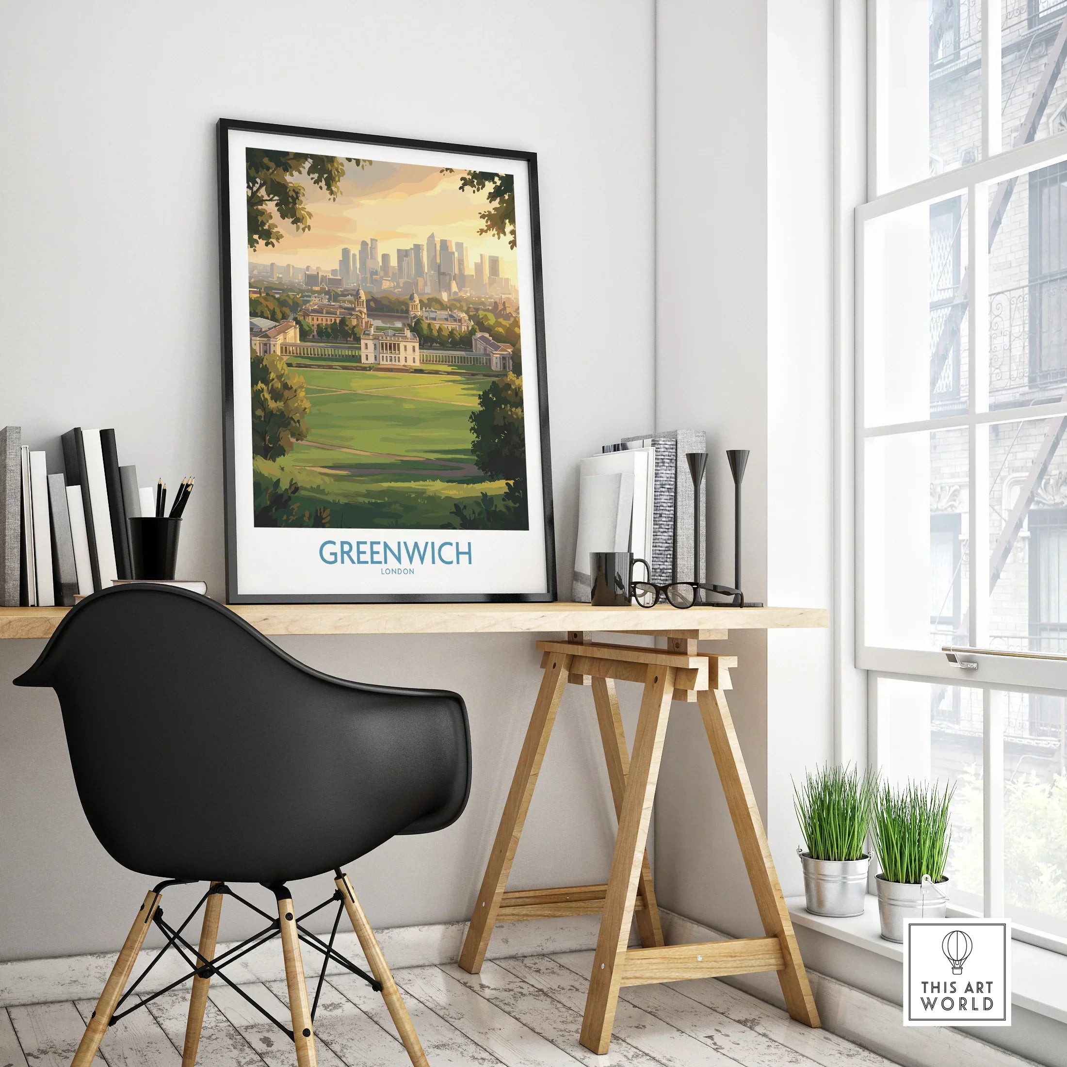 Greenwich London travel poster in black frame on modern office desk with natural light