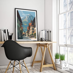 Gruyères Switzerland Wall Art Print | Medieval Village Street Travel Poster displayed in a modern interior with desk and chair.