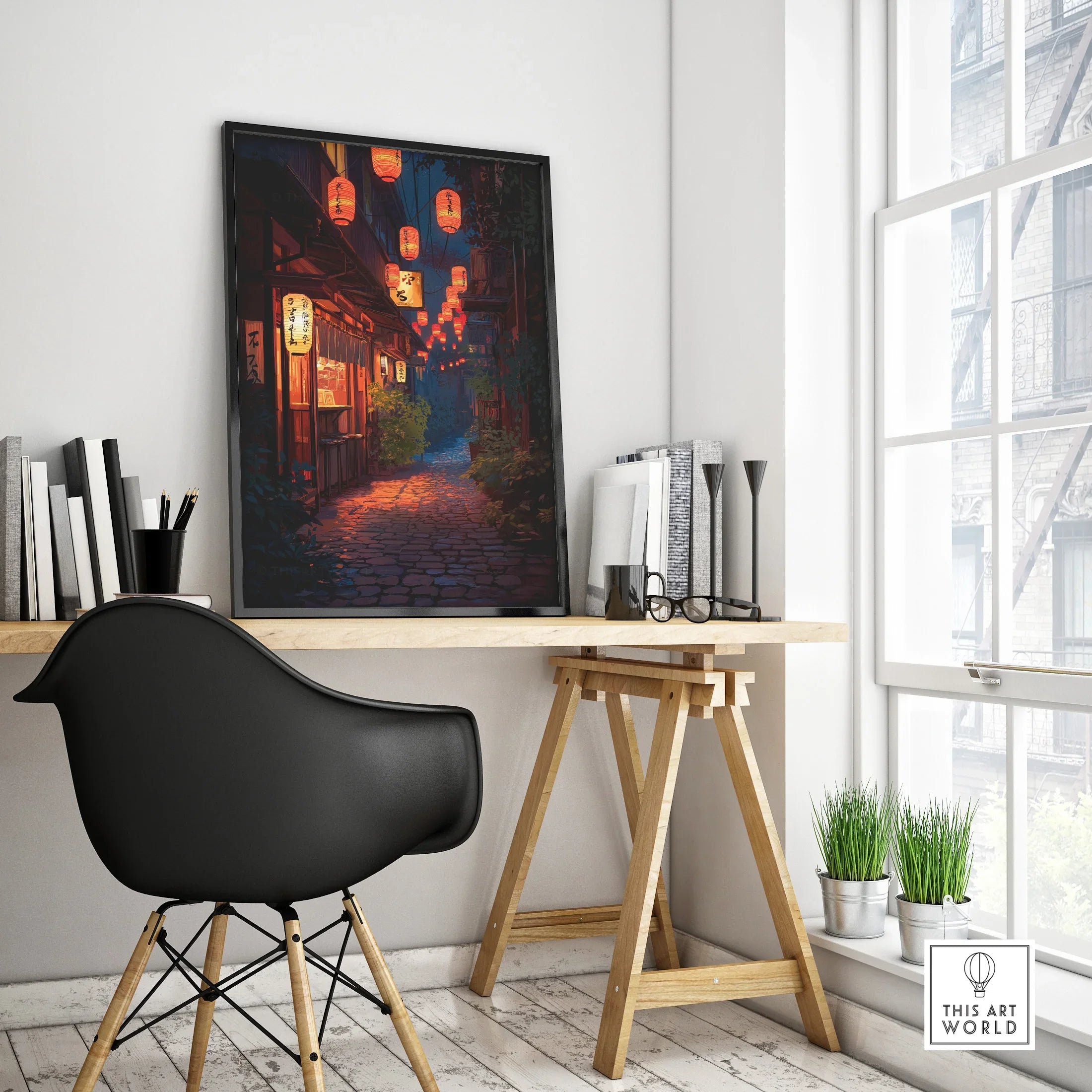 Framed modern Japan street art print with lanterns on a minimalist office desk
