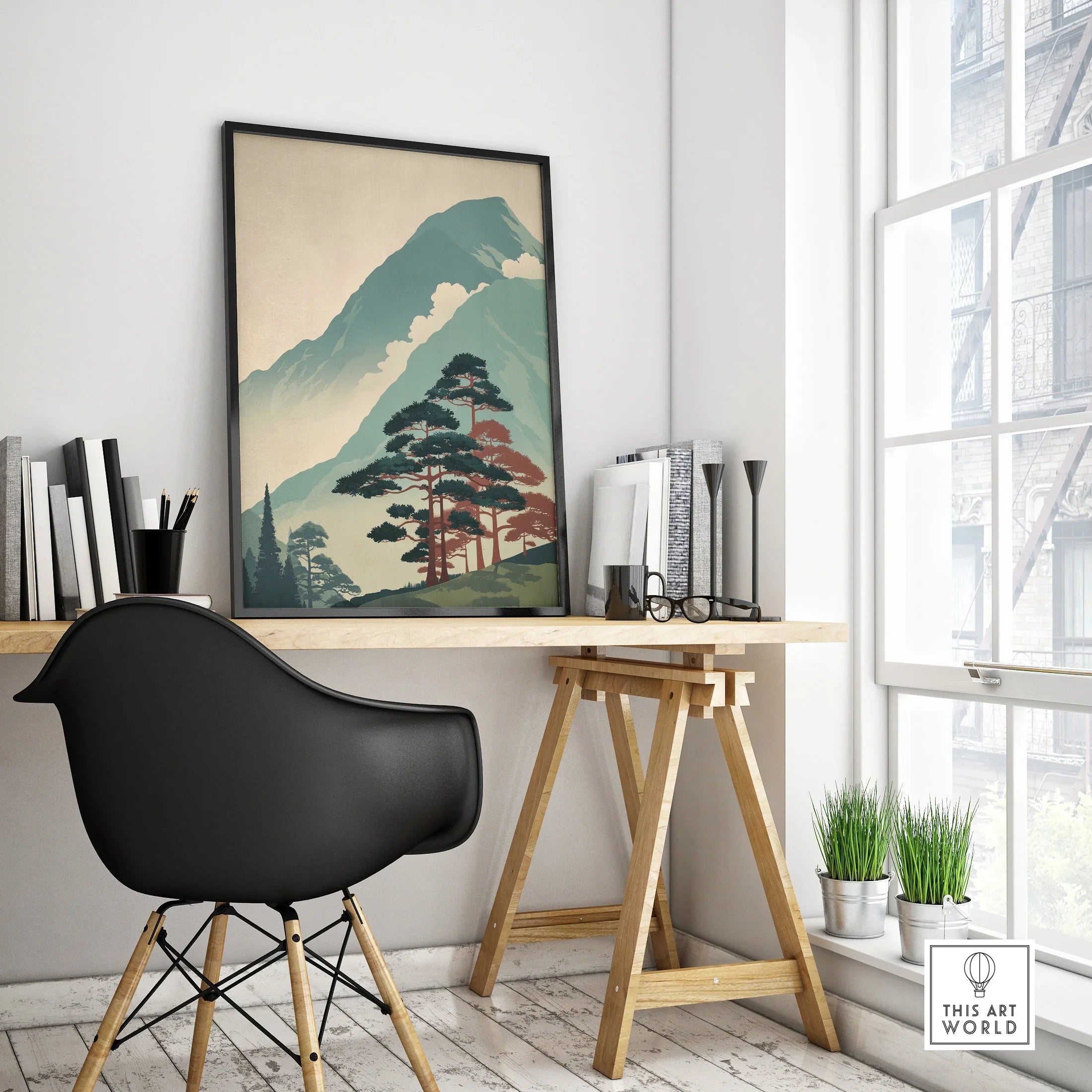 Modern office desk with framed Japanese woodblock-style mountain landscape wall art