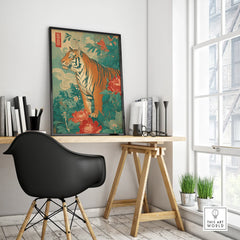 Framed modern Japanese tiger art poster on office desk, vibrant floral wall decor