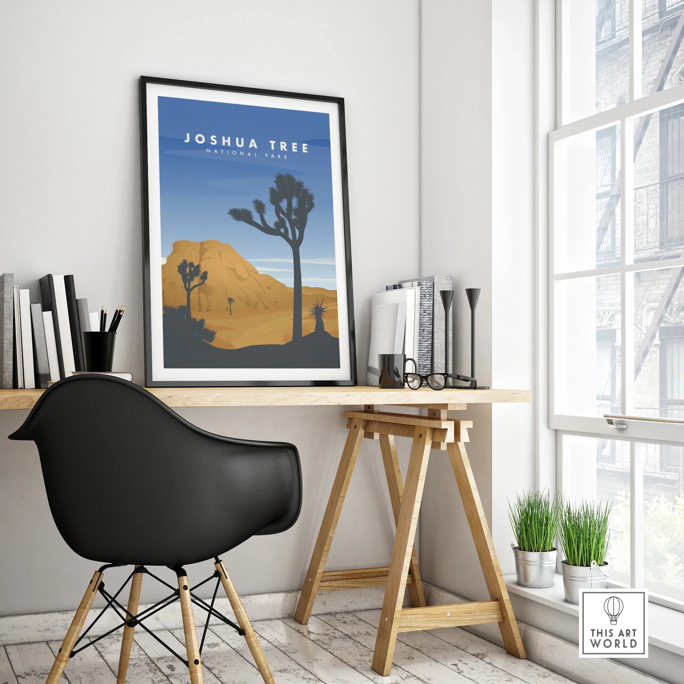 Framed Joshua Tree National Park travel poster on modern office desk with black chair