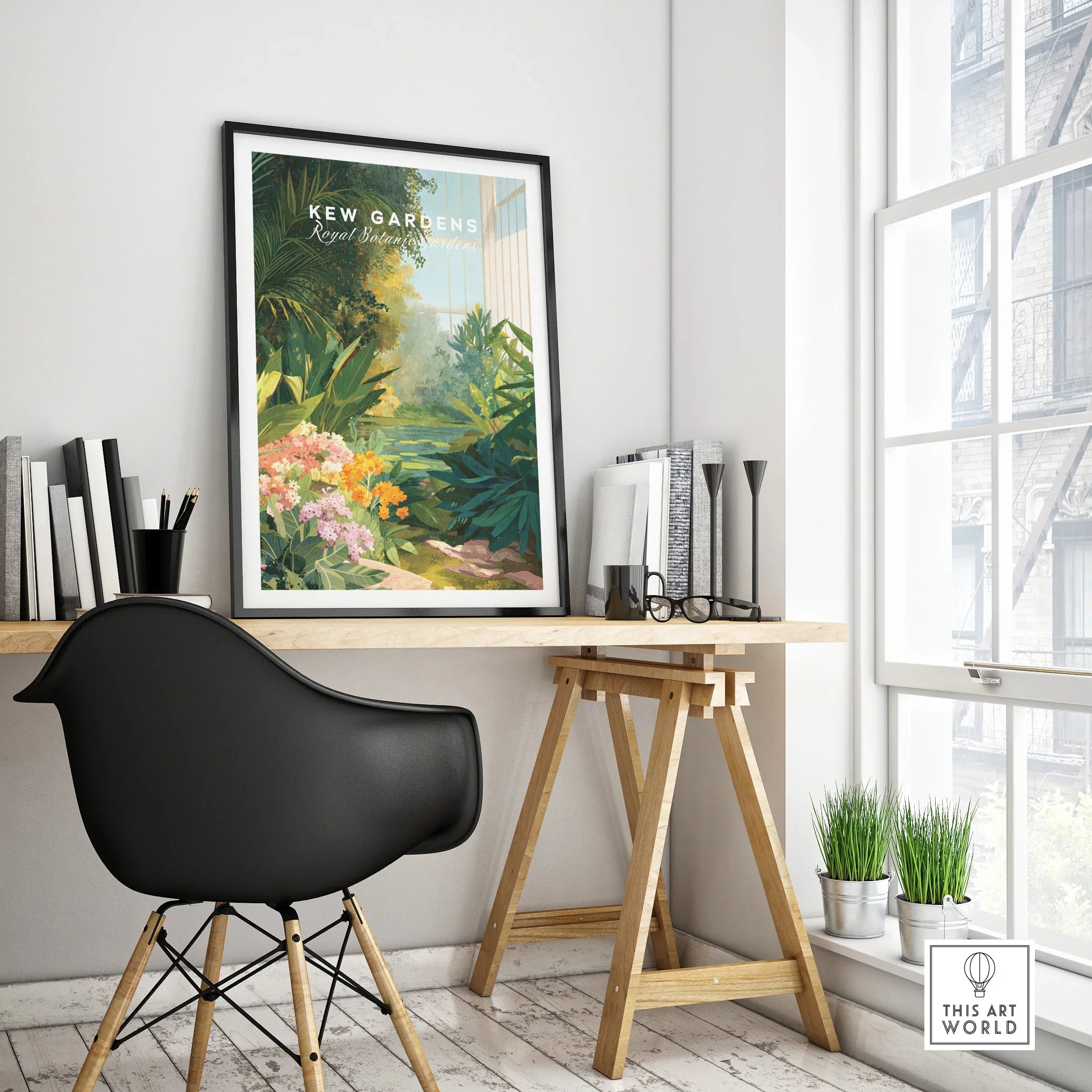 Framed Kew Gardens travel poster on modern office desk with plants and decor
