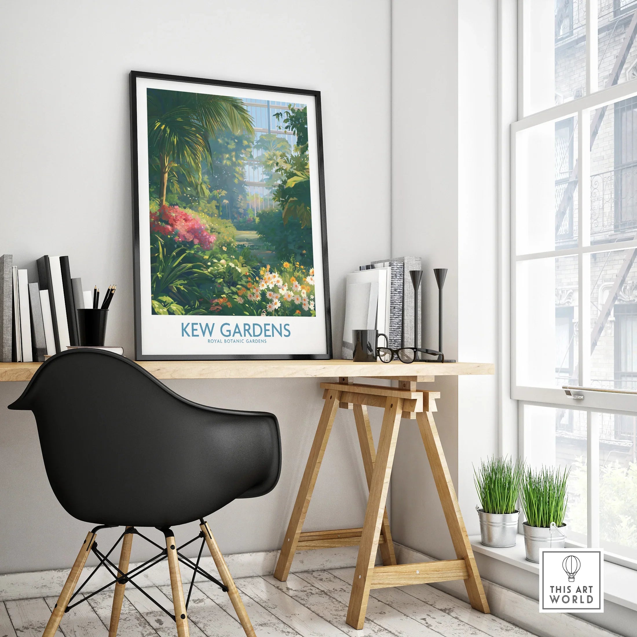 Framed Kew Gardens travel poster on modern office desk in bright, minimal home decor.