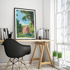 Framed Kew Palace travel poster on a modern home office desk with natural light