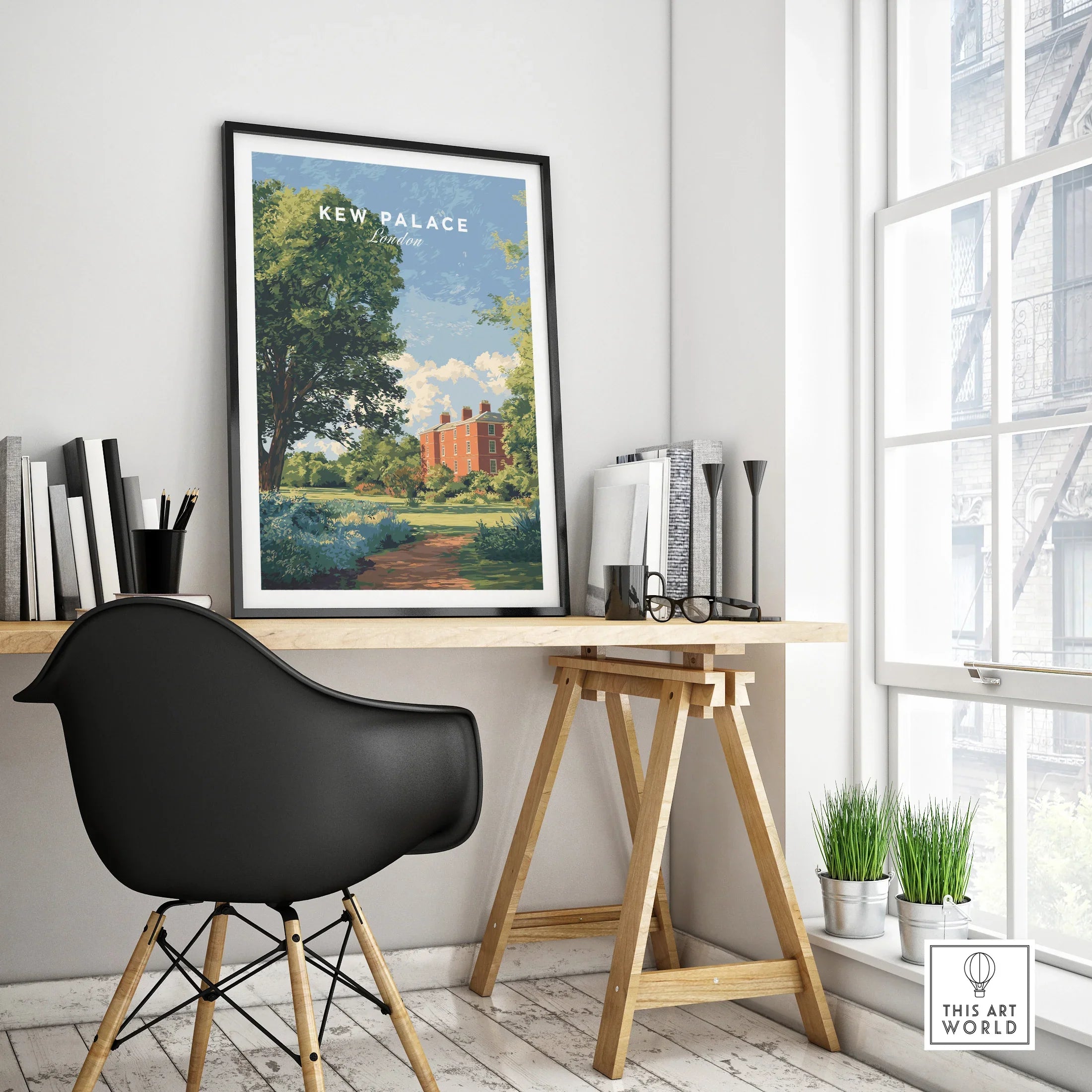 Framed Kew Palace travel poster on modern office desk with black chair and window view