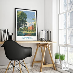 Framed Kew Palace travel poster on modern office desk with black chair and plants