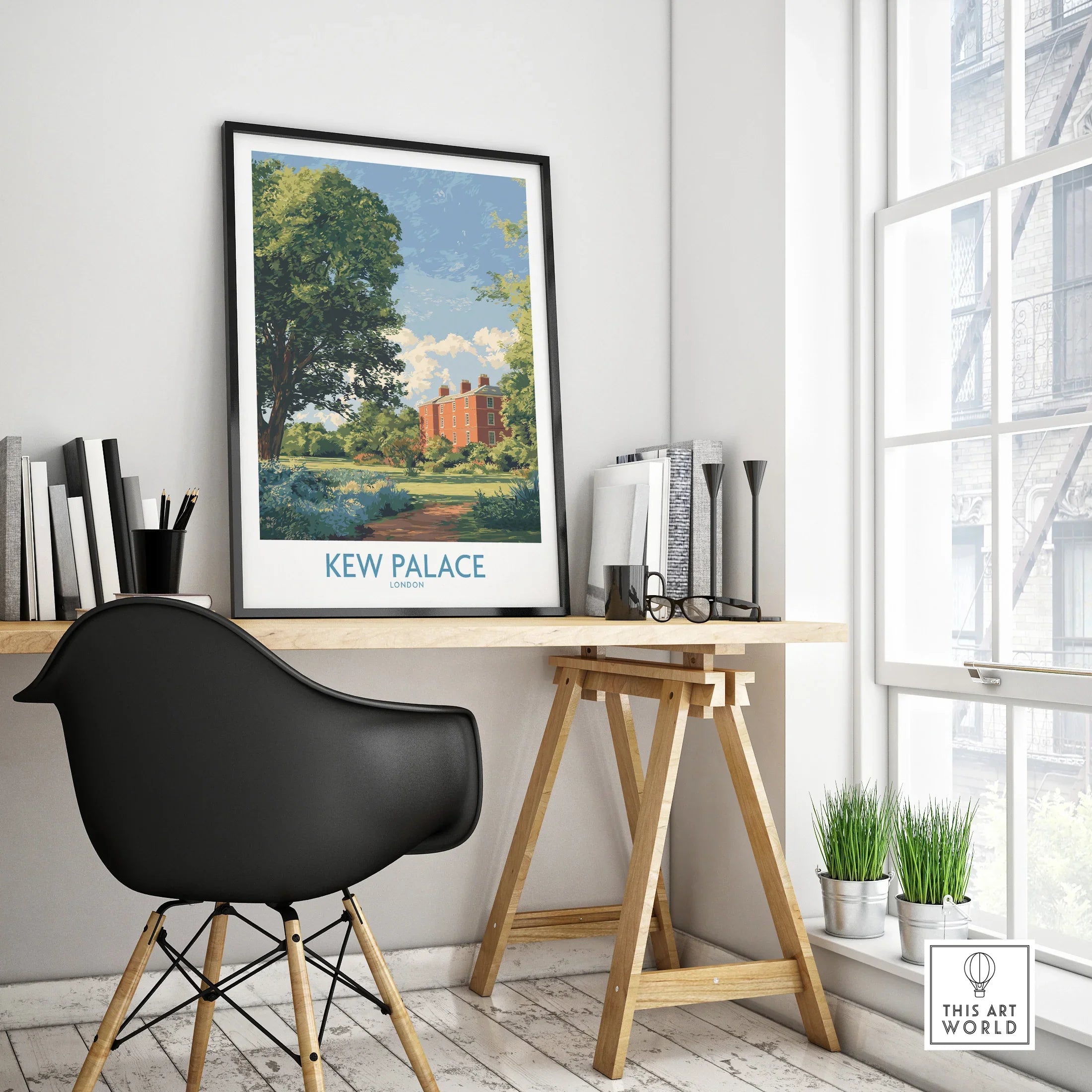 Framed Kew Palace travel poster on modern office desk with black chair and plants