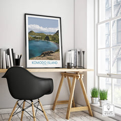Framed Komodo Island travel poster on modern office desk with black chair and books