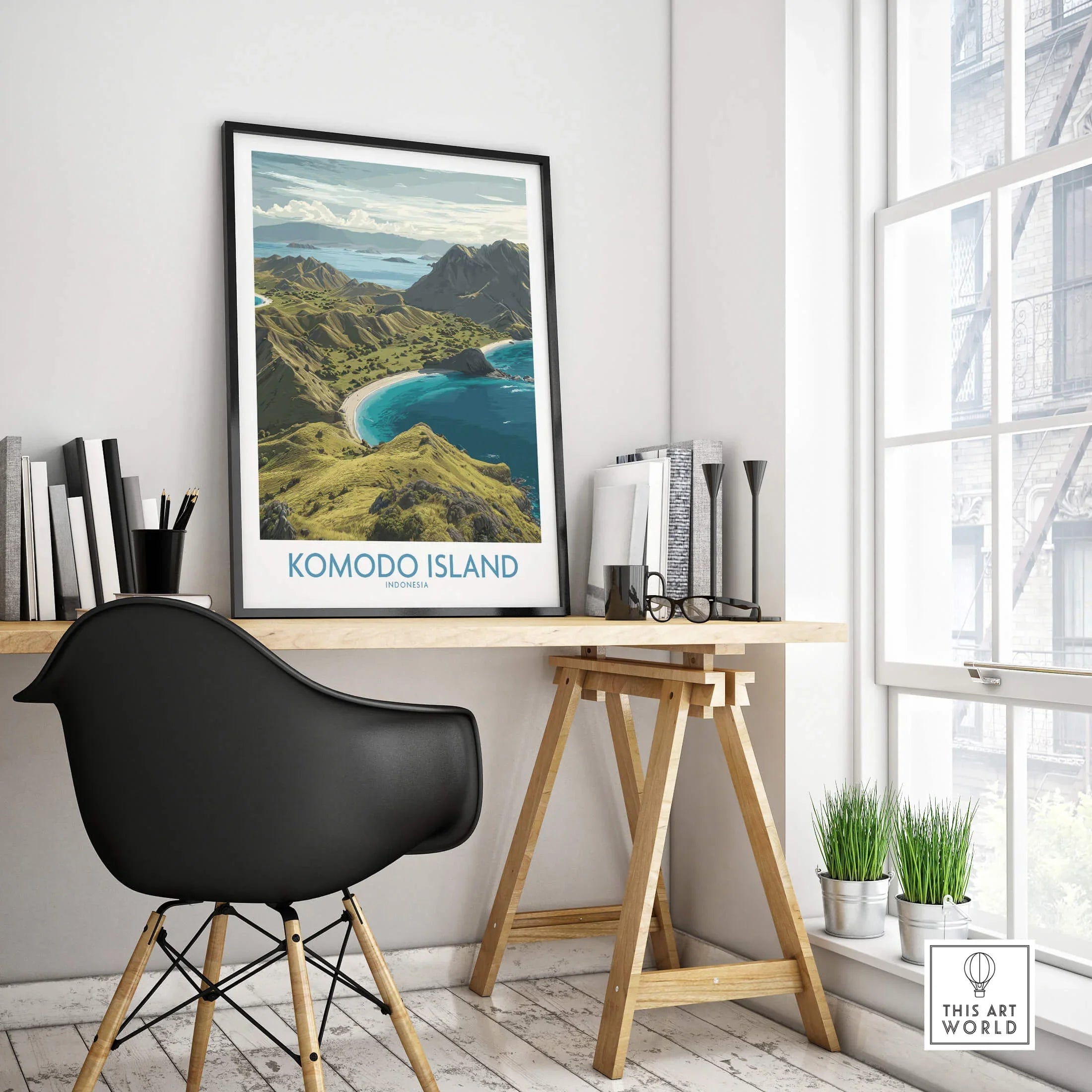 Komodo Island travel poster in black frame on modern office desk with books and decor