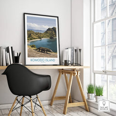 Komodo Island travel poster in black frame on modern office desk with black chair