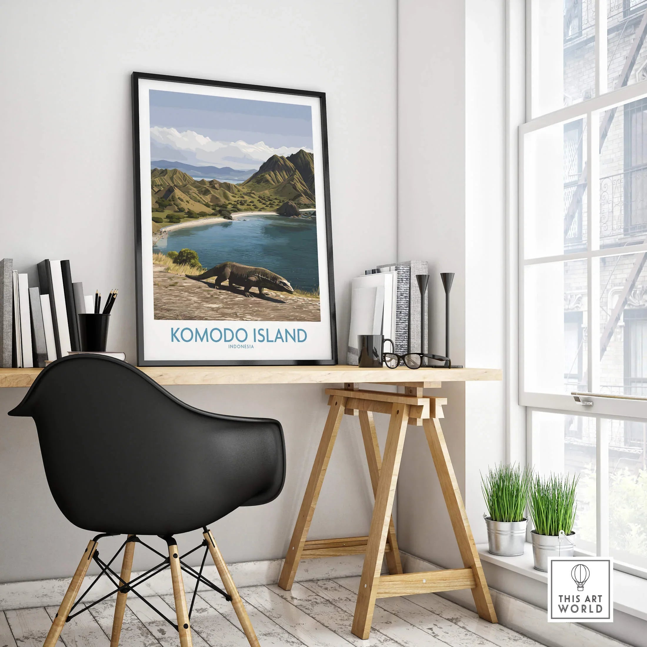 Komodo Island travel poster in black frame on modern office desk with black chair