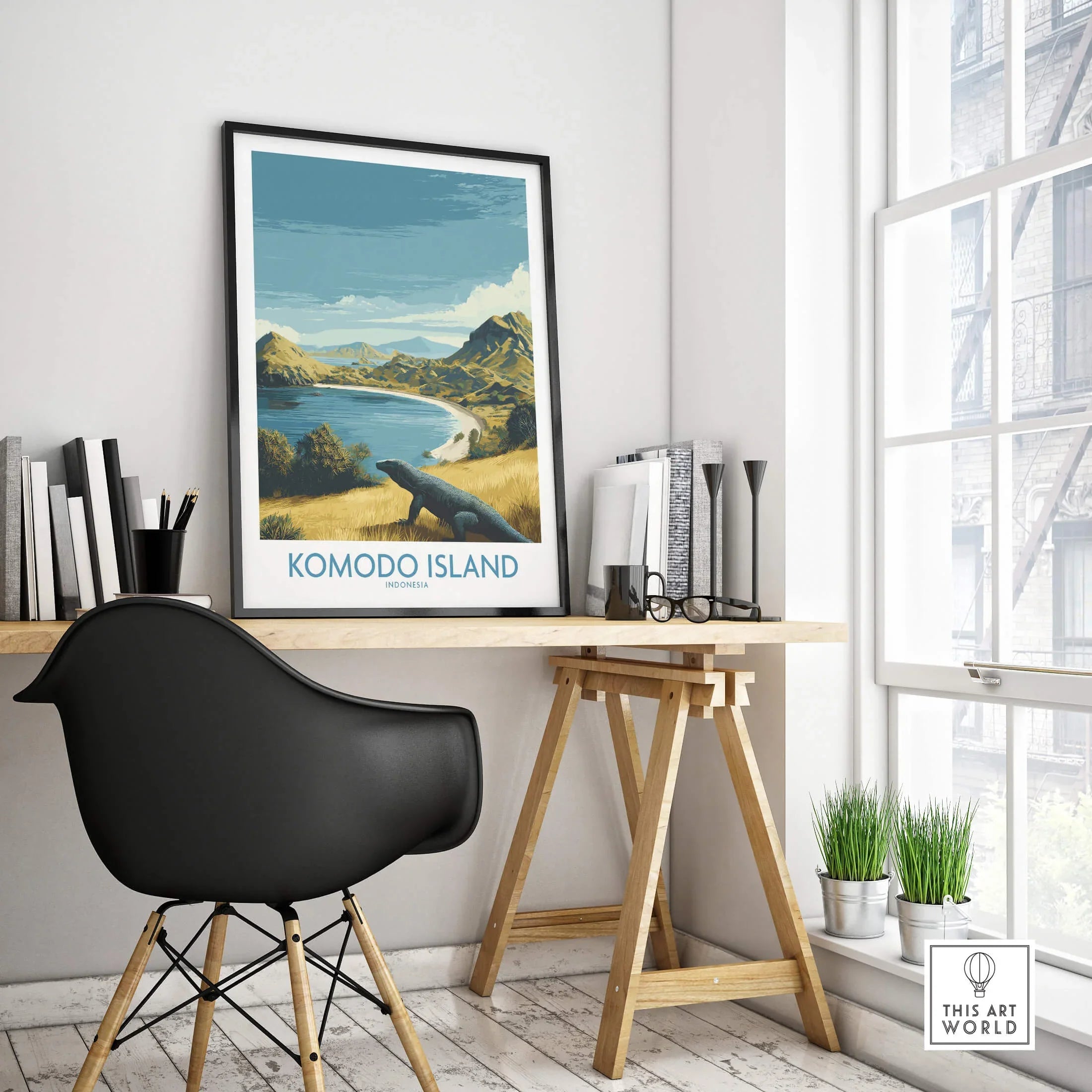 Komodo Island travel poster in black frame on modern office desk with city view