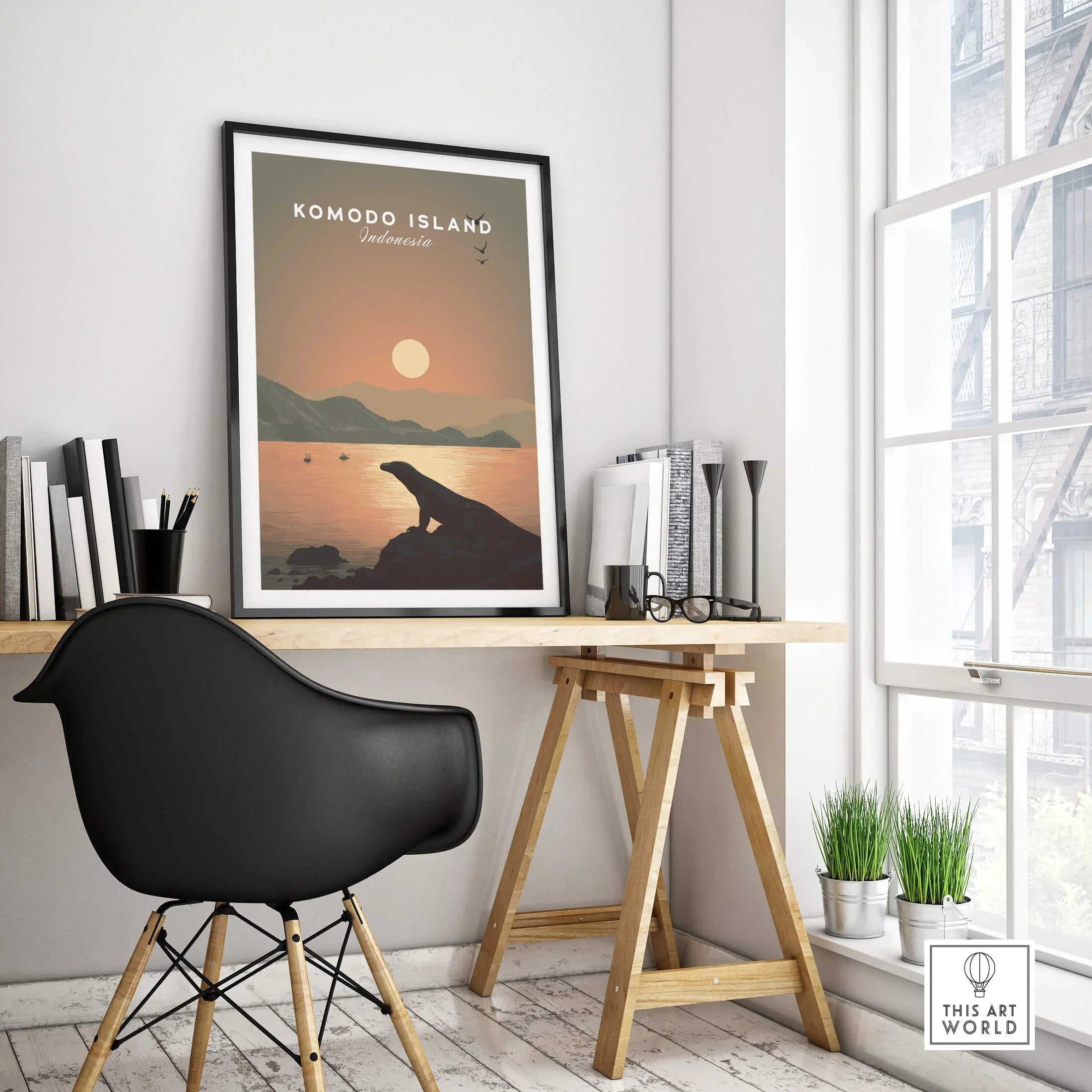Komodo Island travel poster with sunset in black frame on modern office desk