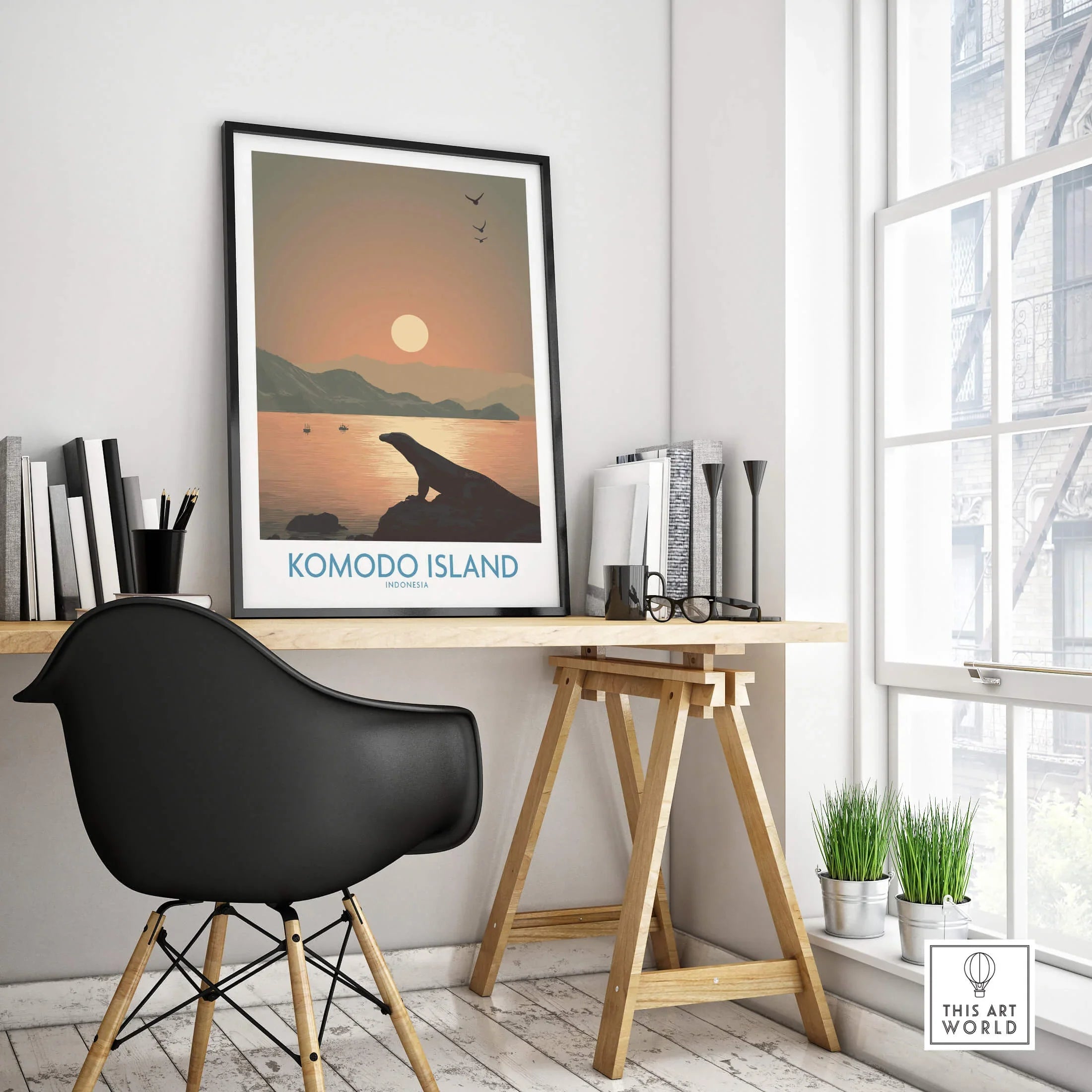 Komodo Island travel poster in black frame on modern office desk with chair and decor