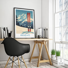 Framed Kronplatz ski travel poster on a modern office desk near window