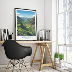 Framed Llanberis Pass travel poster on modern office desk with black chair and decor