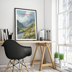 Framed Llanberis Pass travel poster on modern office desk with natural light