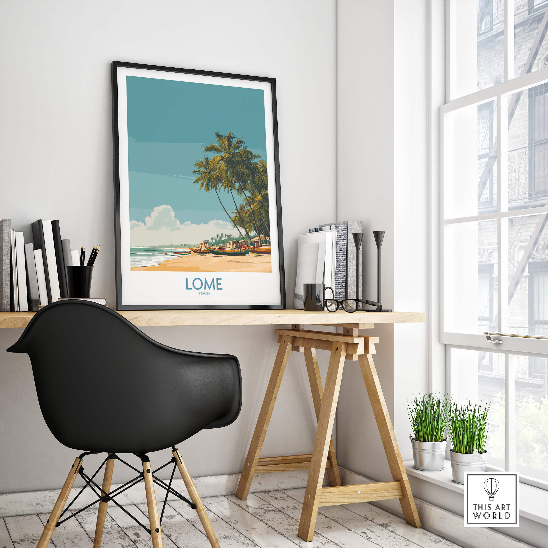 Lomé Togo Canvas Print | Tropical Coastal Village Scene Posters displayed in a modern workspace with a stylish black chair.