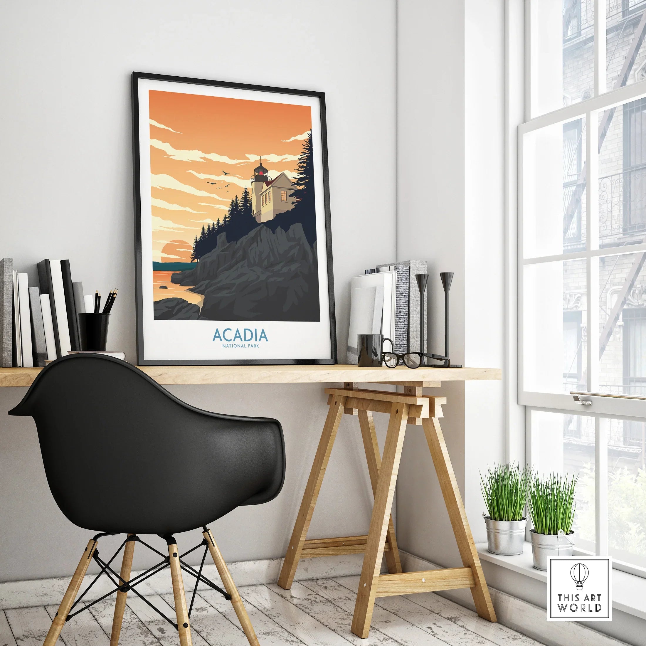 Acadia National Park travel poster with lighthouse, sunset, and forest on office desk