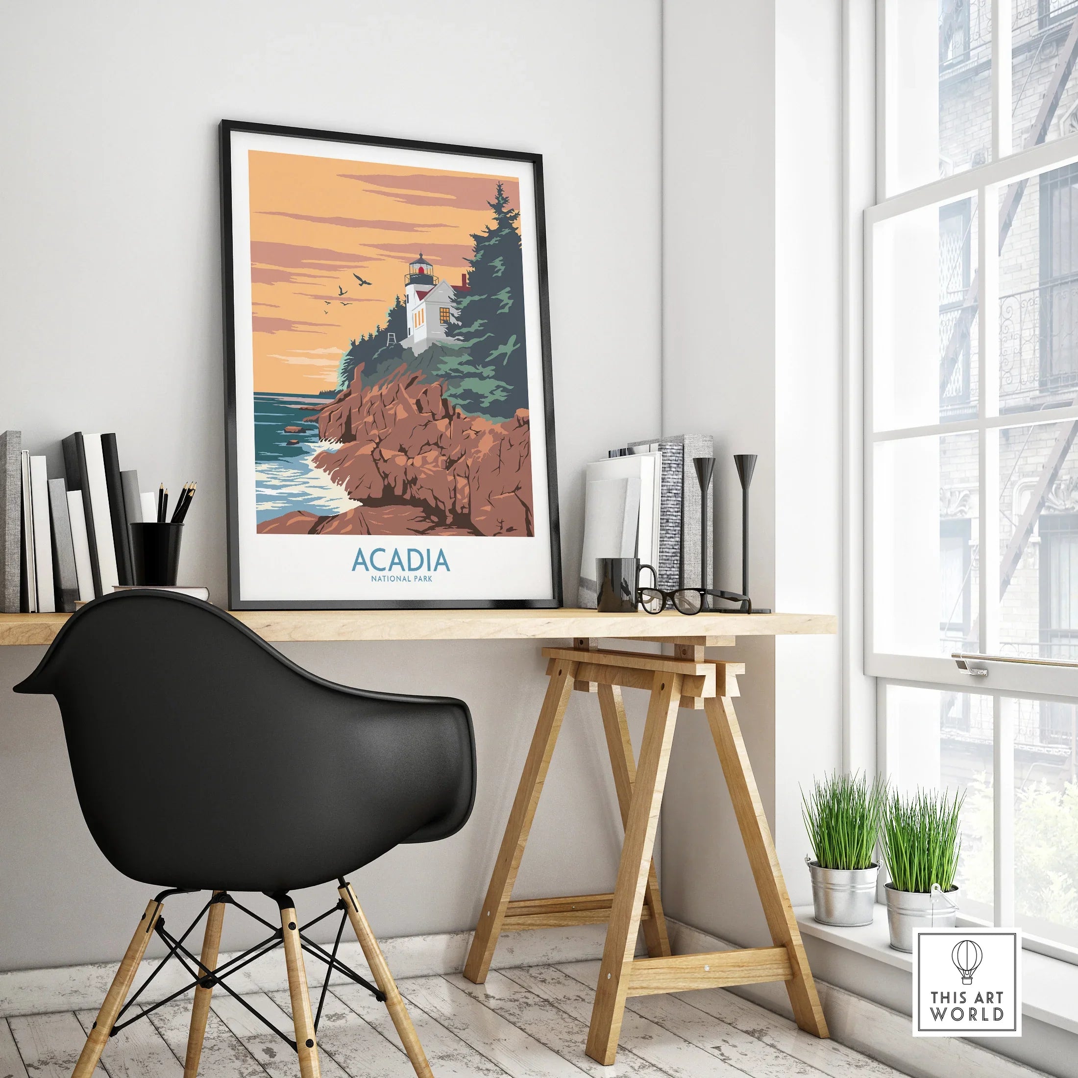 Acadia National Park framed travel poster on modern office desk, sunset lighthouse scene