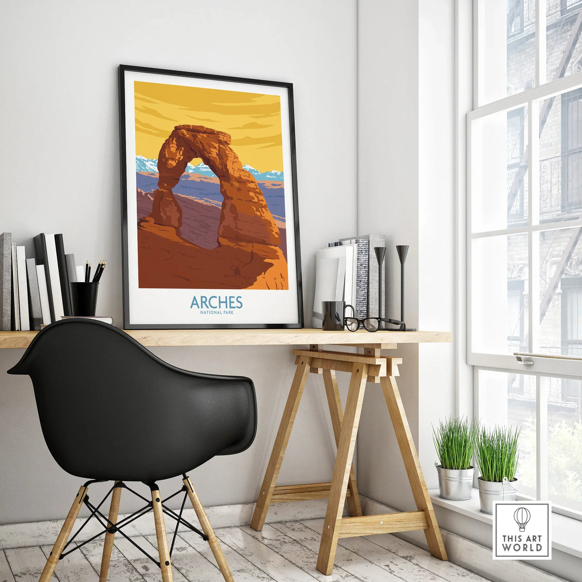 Framed Arches National Park travel poster on modern office desk, natural light, minimalist decor